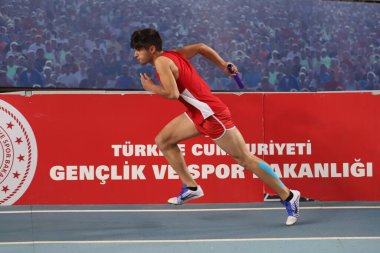 ISTANBUL, TURKEY - FEBRUARY 07, 2021: Undefined athlete running 4x400 metres relay during Turkish Indoor Athletics Championships