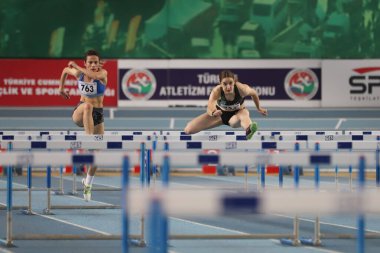 ISTANBUL, TURKEY - FEBRUARY 06, 2021: Athletes running 60 metres hurdles during Turkish Indoor Athletics Championships