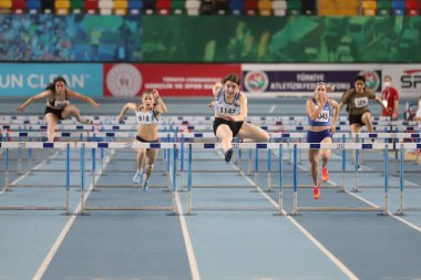 ISTANBUL, TURKEY - FEBRUARY 06, 2021: Athletes running 60 metres hurdles during Turkish Indoor Athletics Championships