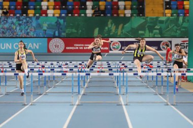 ISTANBUL, TURKEY - FEBRUARY 06, 2021: Athletes running 60 metres hurdles during Turkish Indoor Athletics Championships