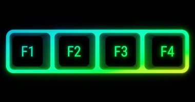 Colorful illuminated keyboard F keys closeup in soft focus