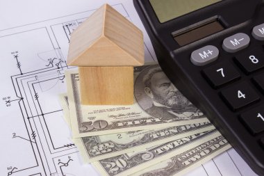 Ev ahşap bloklar ve para birimlerinin dolar çizim, ev kavramı bina inşaat hesap makinesiyle