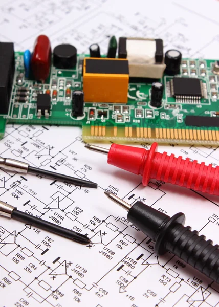 Printed circuit board. precision tools and cable of multimeter on diagram of electronics — Stock Photo, Image