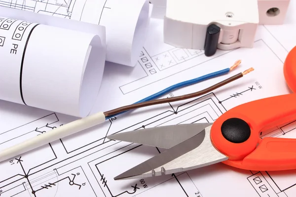 Accessories for engineer jobs and rolls of diagrams on construction drawing — Stock Photo, Image