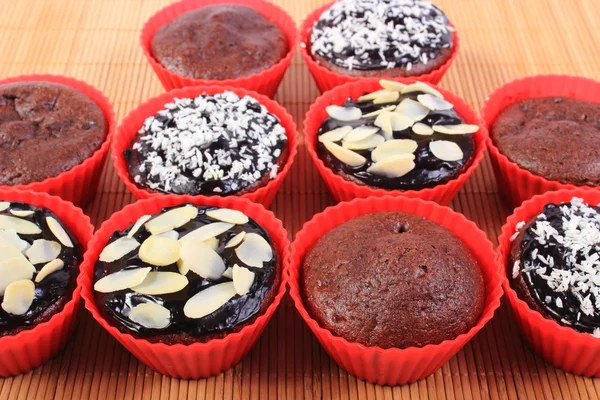 Chocolate muffins with desiccated coconut and almonds — Stock Photo, Image