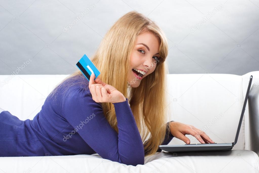 Woman with credit card paying over internet for online shopping, modern technology