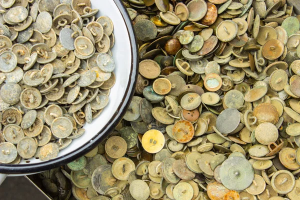 Heap of old rusty buttons for sale at the bazaar — Stock Photo, Image