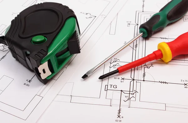 Work tools on electrical construction drawing of house — Stockfoto