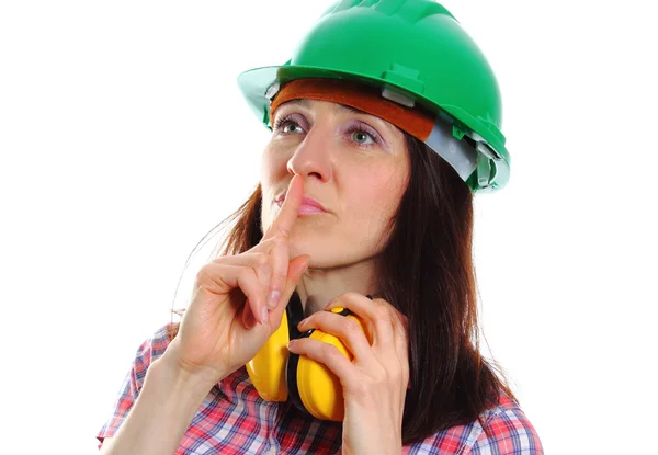 Woman wearing protective helmet and headphones — Stock Photo, Image