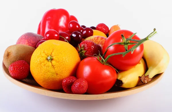 Fresh fruits and vegetables on wooden plate — Stock Photo, Image
