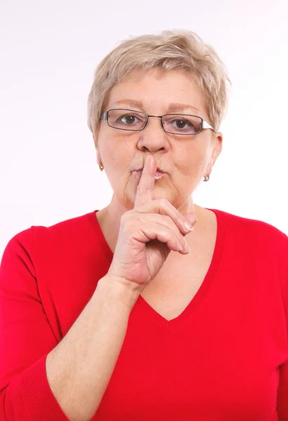 Elderly woman showing hand silence sign, emotions in old age — Φωτογραφία Αρχείου