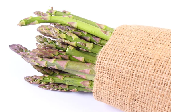 Green asparagus in burlap bag, healthy eating — Stock Photo, Image