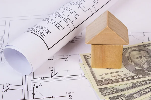Casa de bloques de madera y monedas dólar en el dibujo de construcción, la construcción de concepto de casa — Foto de Stock