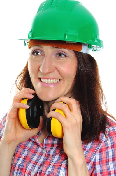 Woman wearing protective helmet and headphones — Stock Photo, Image