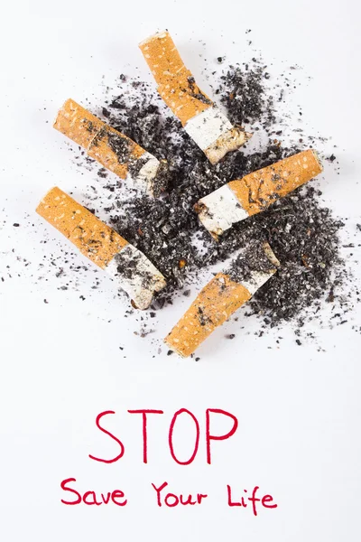 Cigarette butts and ash, stop tobacco save your life