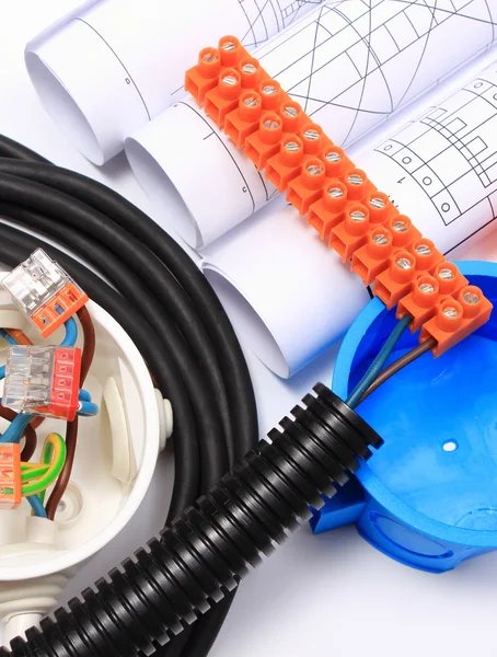 Components for electrical installations and rolls of diagrams — Stock Photo, Image