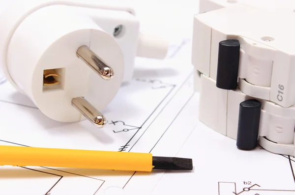 Screwdriver, electric plug and fuse on construction drawing — Stock Photo, Image