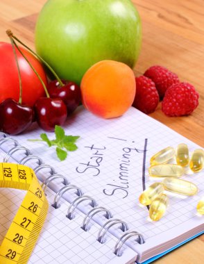 Meyve, Tablet takviyeleri ve santimetre ile defter, zayıflama ve sağlıklı gıda