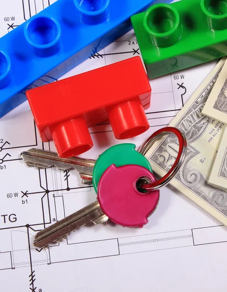 Banknotes, keys and building blocks on drawing of house — Stock Photo, Image