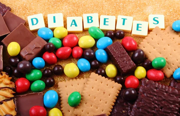En massa godis, farinsocker och ordet diabetes, onyttig mat — Stockfoto
