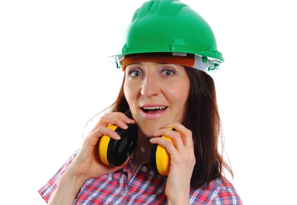 Woman wearing protective helmet and headphones — Stock Photo, Image