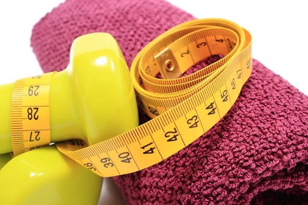 Dumbbells and towel for using in fitness and measure tape — Stock Photo, Image