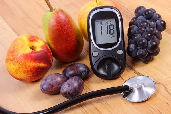 Glucose meter with medical stethoscope and fresh fruits, healthy lifestyle — Stok fotoğraf