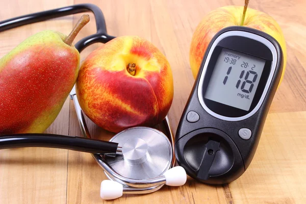 Glucose meter with medical stethoscope and fresh fruits, healthy lifestyle — 스톡 사진