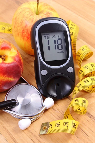 Glucose meter with medical stethoscope and fresh fruits, healthy lifestyle — Stock Fotó