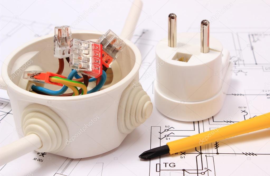 Screwdriver, electrical box and electric plug on construction drawing