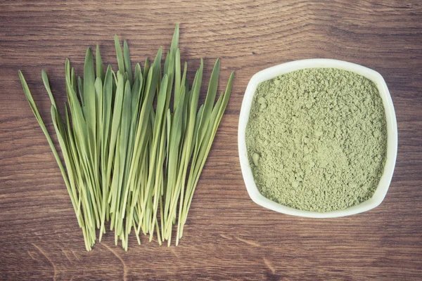 Vintage photo, Barley grass and heap of young powder barley, body detox — Stock Photo, Image