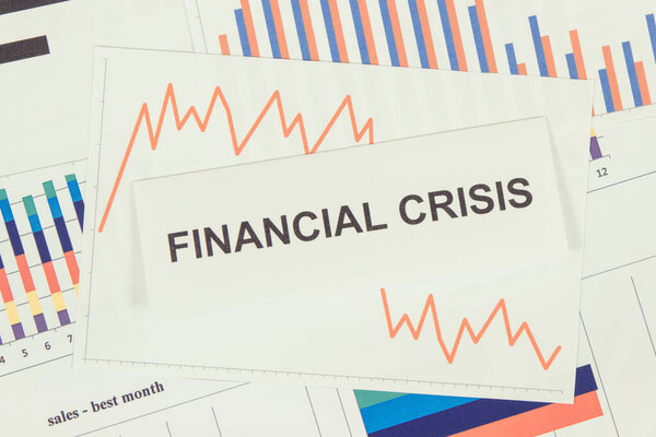 Inscription financial crisis and downward graphs representing financial crash caused by coronavirus. Risk of global recession around world. Covid-19. 2019-nCoV