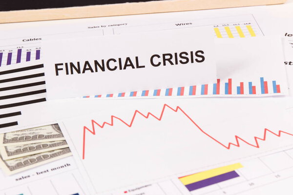 Inscription financial crisis, currencies dollar and declining chart as risk of global financial crash caused by coronavirus. Covid-19