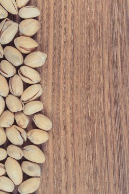 Doğal vitamin ve mineraller içeren fıstıklar. Sağlıklı beslenme. Metin veya yazı için yer