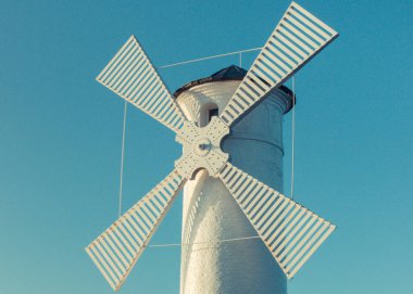 Swinoujscie, West Pomeranian - Poland - June 14, 2021: View on windmill Stawa Mlyny. Charateristic navigational mark and lighthouse clipart
