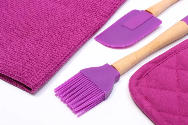 Purple silicone kitchen accessories on white background — Stock Photo, Image