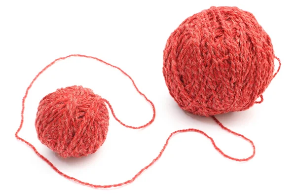 Closeup of red small and big wool ball. White background — Stock Photo, Image