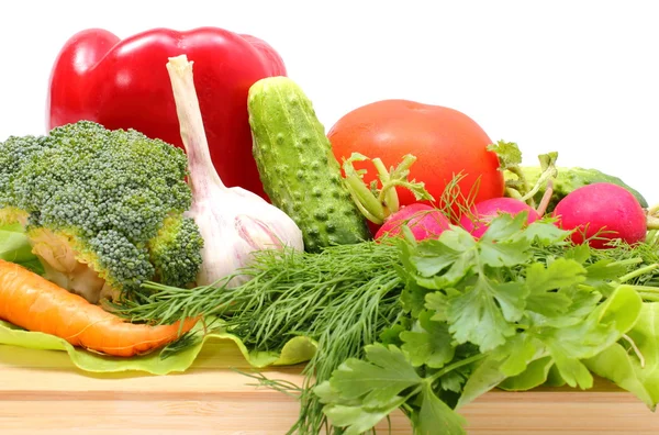 Fresh ripe raw vegetables on wooden cutting board — Stock Photo, Image