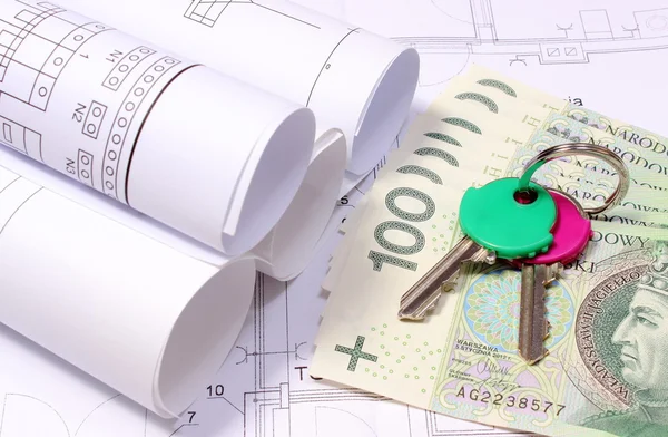 Rolled electrical diagrams on construction drawing of house and money with keys — Stock Photo, Image