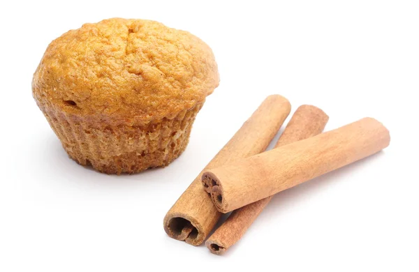 Fresh baked carrot muffin and cinnamon stick. White background — Stock Photo, Image