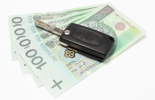 Heap of money with car key on white background — Stock Photo, Image