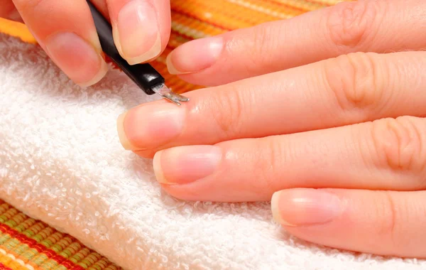 Woman trimming cuticles of hand, manicure — Stock Photo, Image