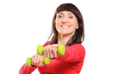 Güzel esmer dumbbells ile fitness egzersiz sırasında