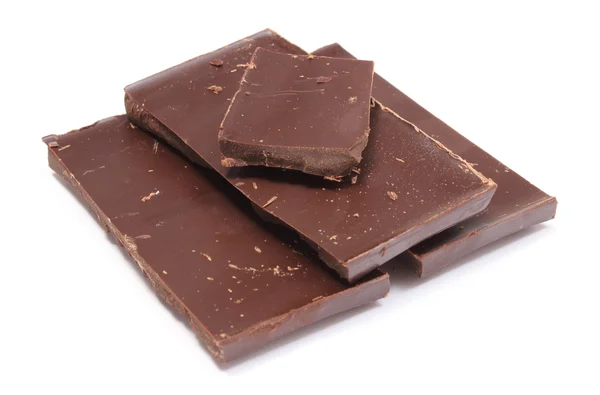 Closeup of dark chocolate pieces on white background — Stock Photo, Image