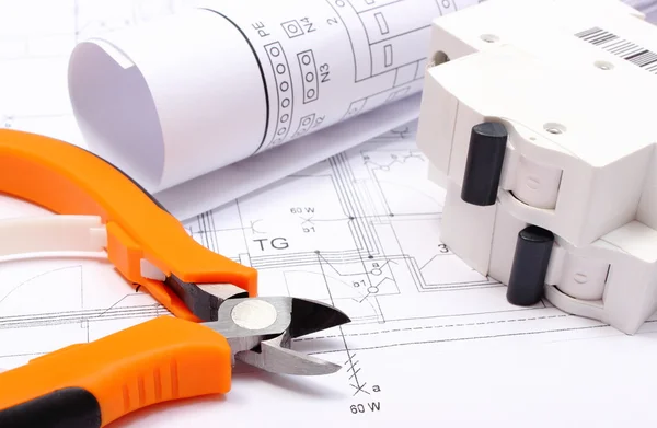 Electrical diagrams, electric fuse and work tools on construction drawing of house — Stock Photo, Image