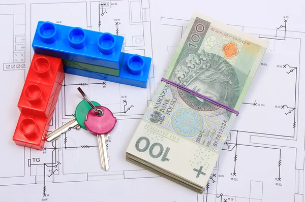 Heap of banknotes, keys and building blocks on drawing of house — Stock Photo, Image