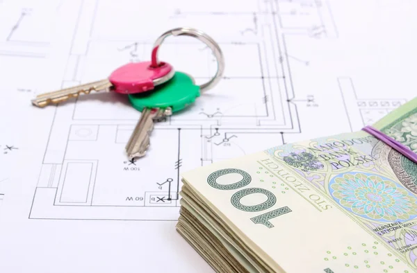 Heap of banknotes and keys on construction drawing of house — Stock Photo, Image