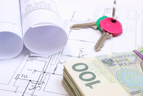 Heap of banknotes, keys and electrical diagrams on drawing of house — Stock Photo, Image