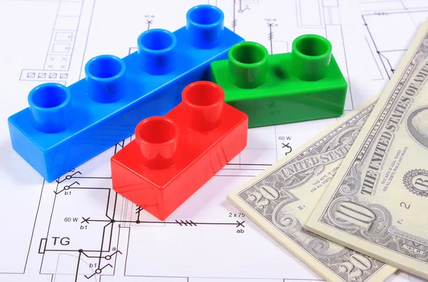 Banknotes and plastic building blocks on drawing of house — Stock Photo, Image