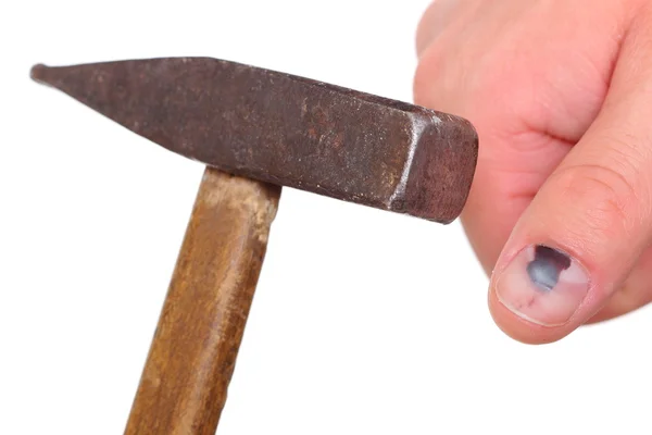 Hammer and finger with black bruised nail on white background — Stock Photo, Image